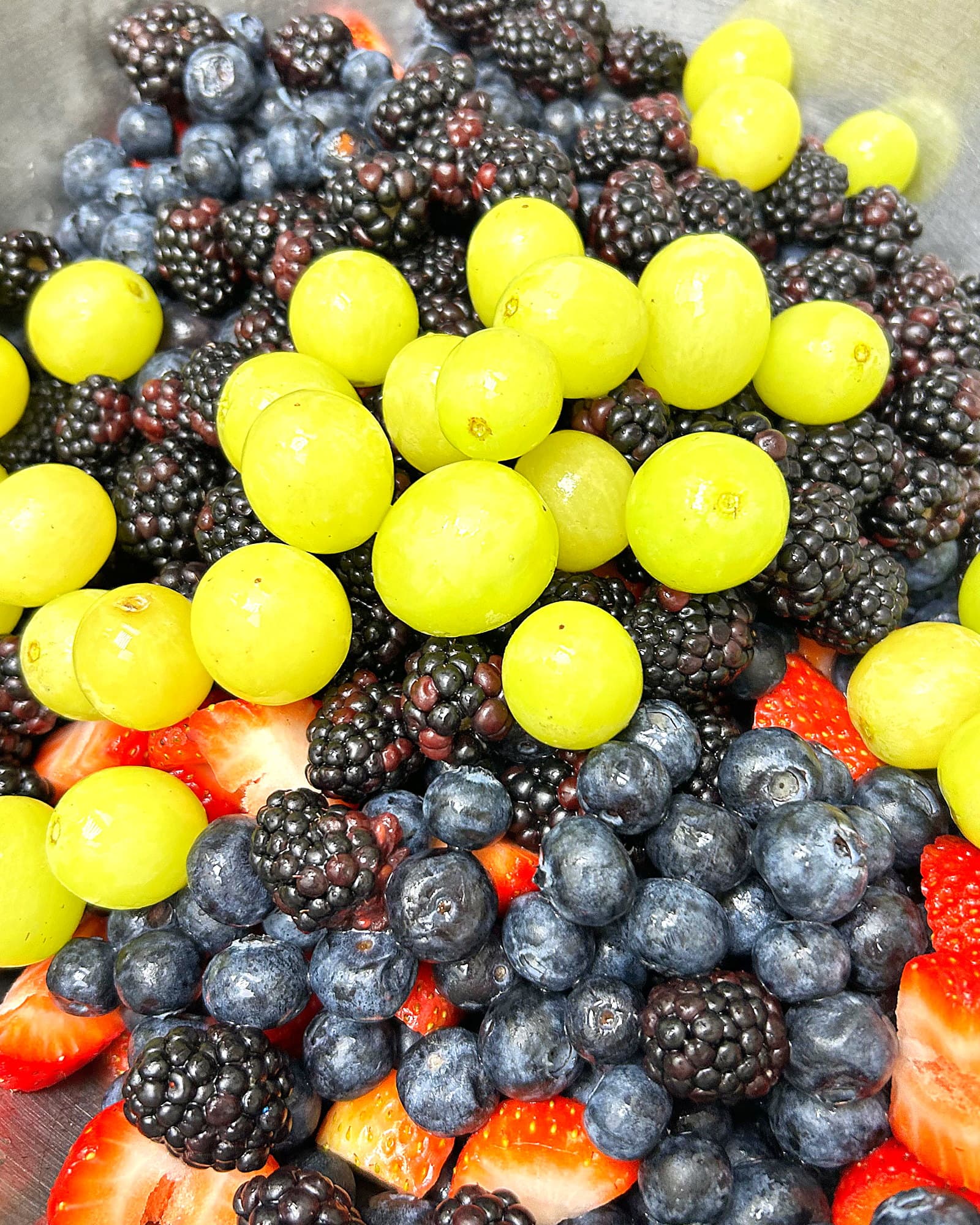Fresh strawberries, blueberries, blackberries, and grapes