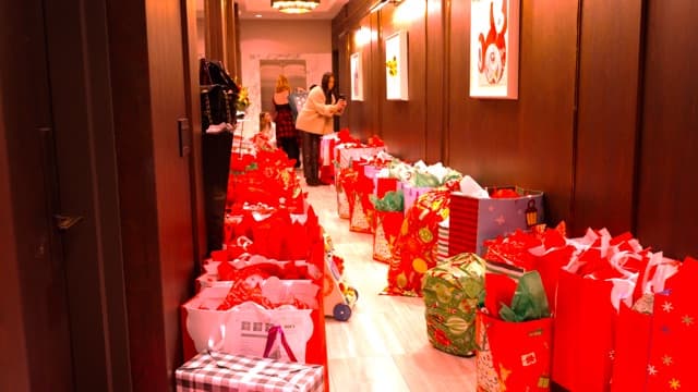 Another view of Christmas Drive gift bags staged for delivery